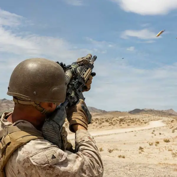 U.S. Marine Corps Lance Cpl. Jeremiah Smith fires an M27 Infantry Automatic Rifle during counter-drone training at Twentynine Palms, California, on July 17, 2026, as Marines practice engaging fast-moving small unmanned aerial systems at close range.