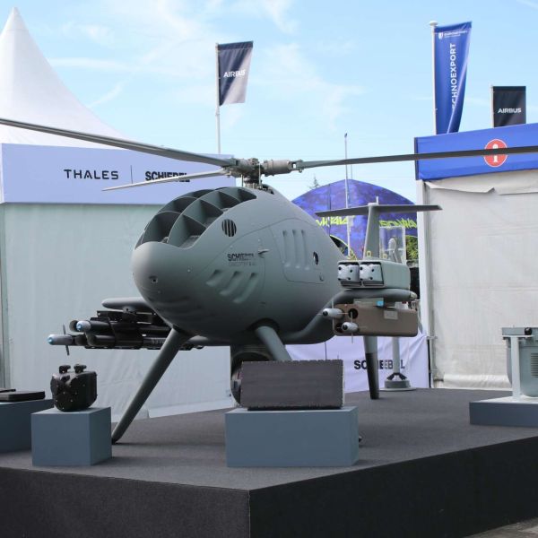 Schiebel and Thales unveiled an armed CAMCOPTER S-301 VTOL unmanned aircraft at Eurosatory 2026, integrating loitering munitions, guided rockets, and advanced sensors into a single multi-role combat system (Picture Source: Army Recognition Group)