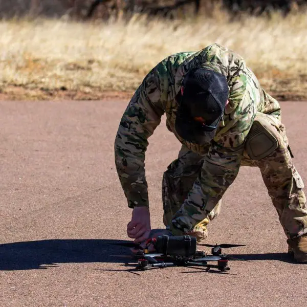 A Green Beret from the U.S. Army’s 10th Special Forces Group (Airborne) performs pre-flight inspections on a small unmanned aerial system during the Advanced Drone Course at Fort Carson, Colorado, on February 19, 2026.