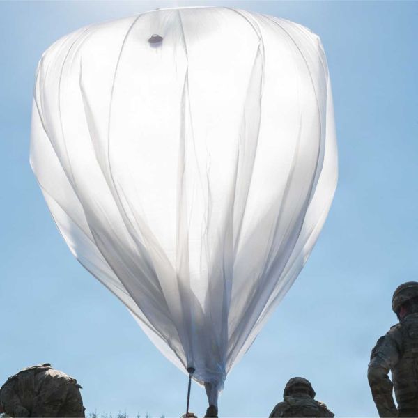 U.S. Army Soldiers prepare to launch a helium-filled micro-High-Altitude Balloon at the Yausubetsu Training Area in Hokkaido, Japan, during Exercise Orient Shield 2026 on September 18, 2026, demonstrating the use of high-altitude systems for persistent sensing, communications, and other operational missions.