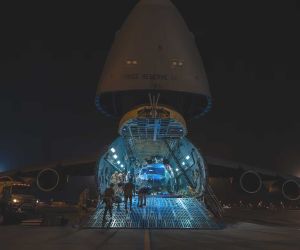 A U.S. Air Force HH-60W Jolly Green II is unloaded from a C-5 Super Galaxy at Camp Lemonnier, Djibouti, on June 10, 2026, marking its deployment to support combat rescue and crisis response missions in East Africa.