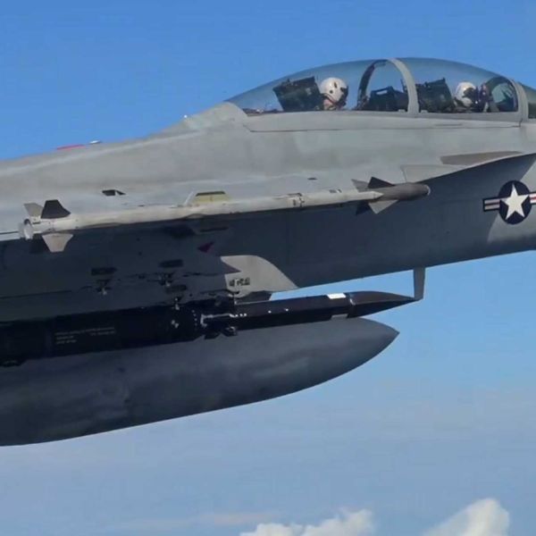 Screenshot from a NAVAIR video released on September 25, 2026, showing a U.S. Navy F/A-18E/F Super Hornet carrying a Blackbeard hypersonic strike missile beneath its wing during flight testing.