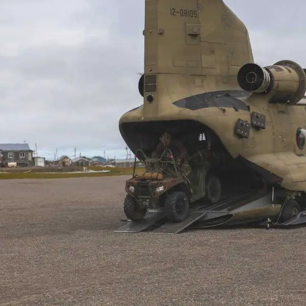 U.S. Army Green Berets from the 10th Special Forces Group (Airborne) unload an all-terrain vehicle from a CH-47 Chinook after landing at Savoonga on St. Lawrence Island, Alaska, during Operation Polar Dagger 2026. The insertion demonstrated the ability to rapidly deploy Special Operations Forces with ground mobility assets into remote Arctic terrain in support of U.S. homeland defense.
