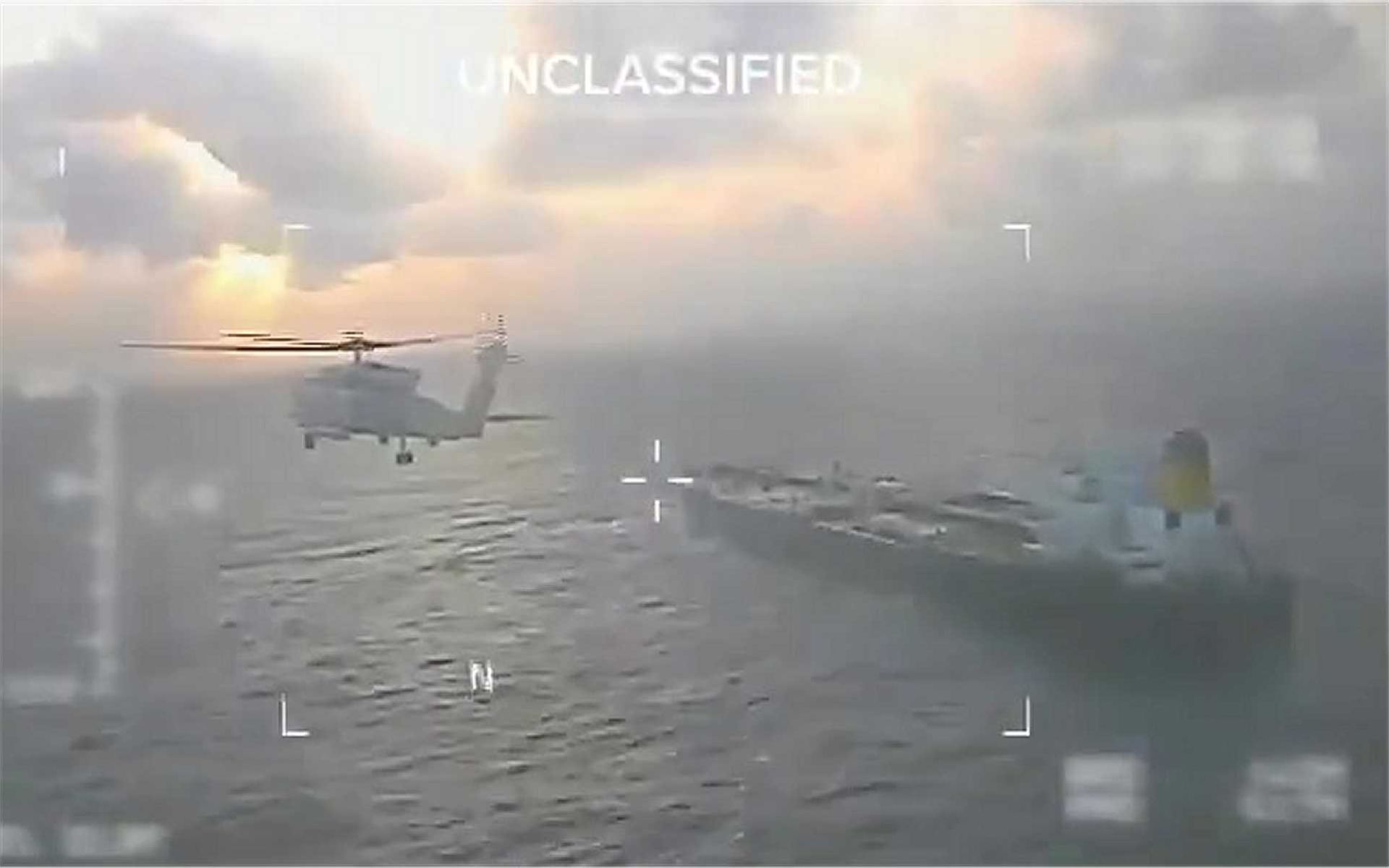 U.S. Coast Guard personnel conduct a high-risk boarding of the oil tanker Centuries in international waters east of Barbados, supported by U.S. Navy helicopters during a maritime interdiction operation targeting sanctioned Venezuelan crude en route to China.