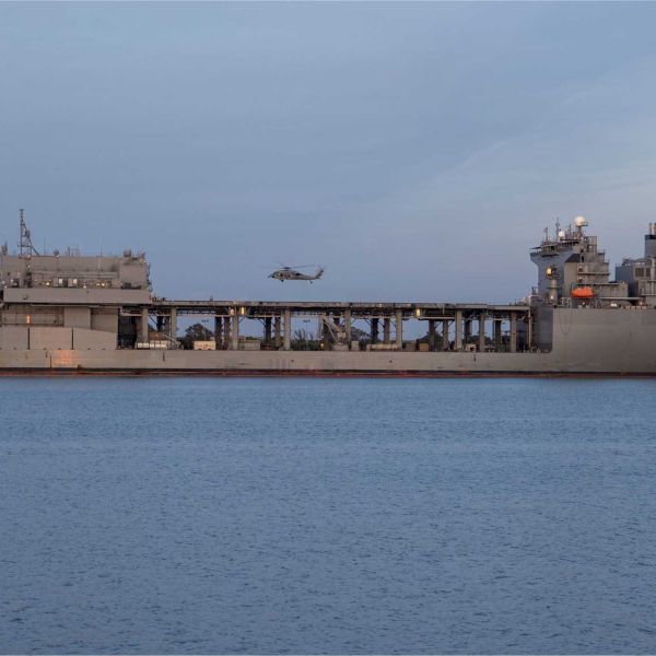 An Expeditionary Sea Base is a 90,000-ton mobile offshore support ship that acts as a floating military hub, providing aviation facilities, mission spaces, personnel accommodation and logistics support for U.S. Navy, Marine Corps, special operations and joint forces without relying on fixed ports or airfields.