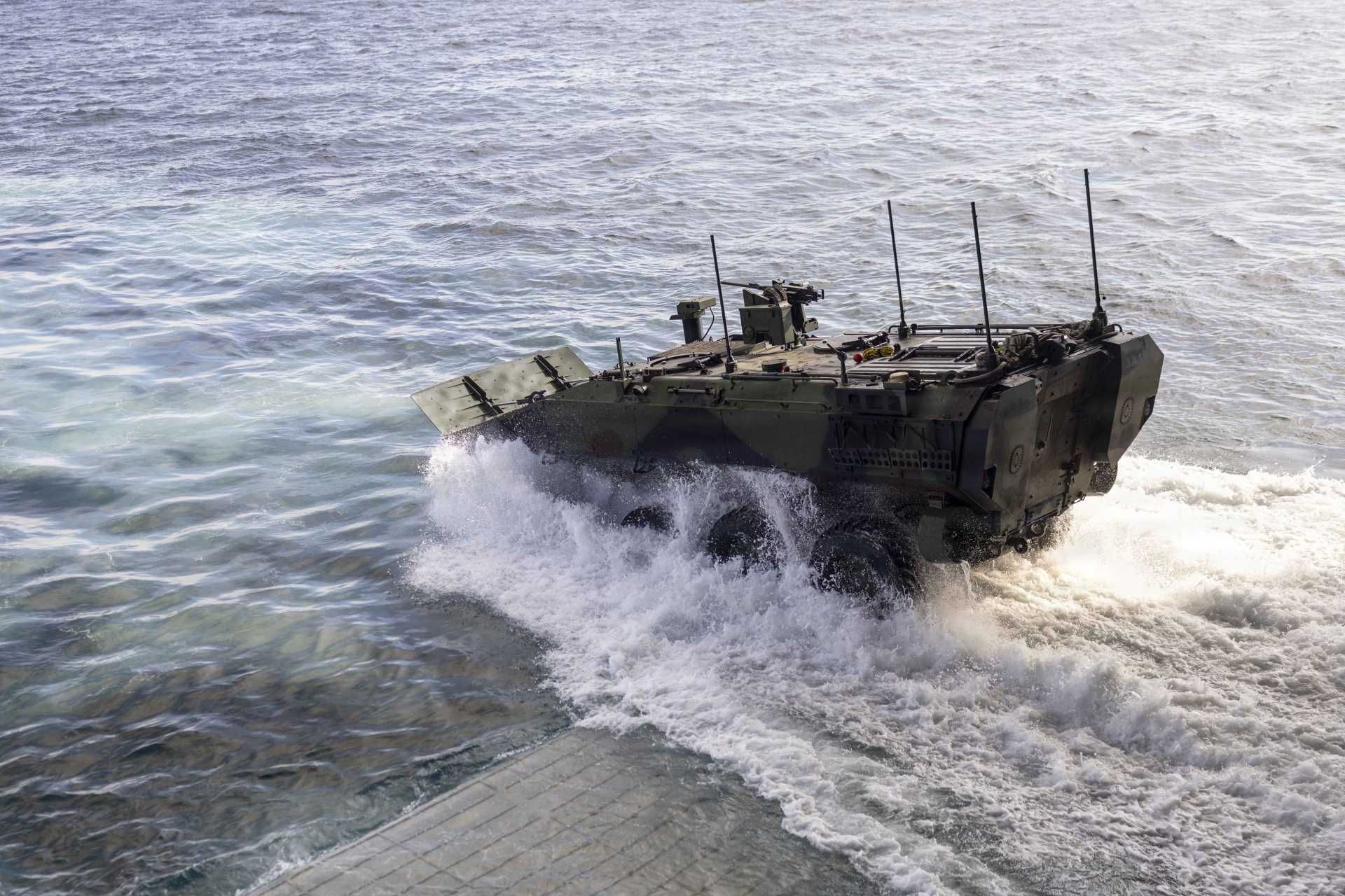 A U.S. Marine Corps ACV-P Amphibious Combat Vehicle personnel carrier assigned to 3rd Assault Amphibian Battalion, 1st Marine Division, disembarks from the Wasp-class amphibious assault ship USS Makin Island (LHD 8) during Quarterly Underway Amphibious Readiness Training 26.2 off the coast of California on January 23, 2026.
