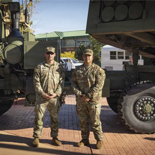 U.S. Army Sgt. 1st Class Matthew Nethers (left) and Sgt. 1st Class Nicolas Adame, assigned to Bravo Company, 1st Battalion, 10th Field Artillery Regiment, 4th Multi-Domain Task Force, stand in front of an M142 HIMARS rocket artillery system during the unit's activation ceremony at Fort Carson, Colorado, on October 8, 2026. (Picture source: U.S. Army)