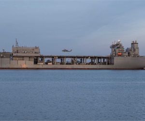 An Expeditionary Sea Base is a 90,000-ton mobile offshore support ship that acts as a floating military hub, providing aviation facilities, mission spaces, personnel accommodation and logistics support for U.S. Navy, Marine Corps, special operations and joint forces without relying on fixed ports or airfields.