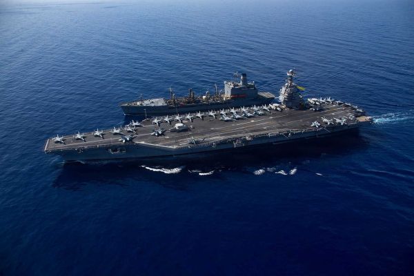 The Gerald R. Ford-class nuclear-powered aircraft carrier represents the centerpiece of U.S. Navy carrier aviation renewal, combining electromagnetic aircraft launch systems, advanced arresting gear and redesigned weapons handling to support sustained air operations at sea. (Picture source: U.S. Department of War/Defense)