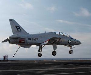 A U.S. Navy T-45C Goshawk advanced jet trainer approaches the flight deck of the Nimitz-class aircraft carrier USS Dwight D. Eisenhower (CVN 69) during carrier qualification operations in the Atlantic Ocean on June 27, 2026. (Picture source: U.S. Department of War/Defense)