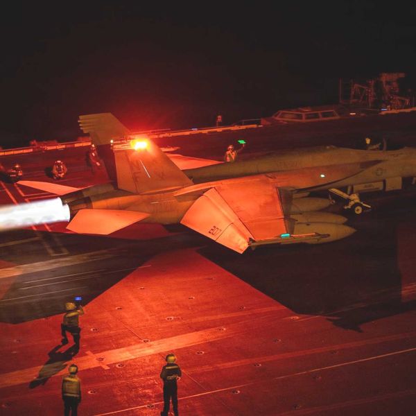 An F/A-18 Super Hornet prepares to launch from the flight deck of USS George Washington (CVN 73) while the aircraft carrier operates in Middle Eastern waters amid sustained U.S. naval activity linked to enforcement of the blockade against Iran.