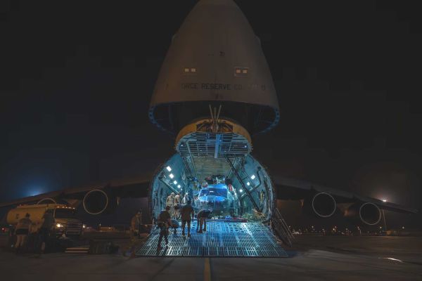 A U.S. Air Force HH-60W Jolly Green II is unloaded from a C-5 Super Galaxy at Camp Lemonnier, Djibouti, on June 10, 2026, marking its deployment to support combat rescue and crisis response missions in East Africa.