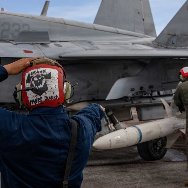 U.S. Marine Corps Cpl. Antonio Barrios, left, and Sgt. Ruben Medina, both aviation ordnance technicians with Marine Fighter Attack Squadron (VMFA) 232, Marine Aircraft Group 12, 1st Marine Aircraft Wing, secure an AGM-88 HARM during an Aviation Training Relocation program at Andersen Air Force Base, Guam, Feb. 5, 2026.