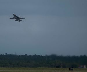 A U.S. Air Force F-16 Fighting Falcon fighter jet modified for the Viper Experimentation and Next-generation Operations Model–Autonomy Flying Testbed (VENOM) program conducts autonomous systems flight testing at Eglin Air Force Base, Florida, in June 2026.
