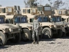 Iraqi Army Iraq light wheeled vehicle Humvee picture . A U.S. soldier walks past Armoured Humvees transferred from the Coalition Forces to the Government of Iraq, at Camp Taji in Baghdad, January 17, 2008. Iraq received 650 U.S. made Humvees on Thursday in Baghdad, a total of 8500 should be handed over within two years the Iraqi Defence Ministry said.