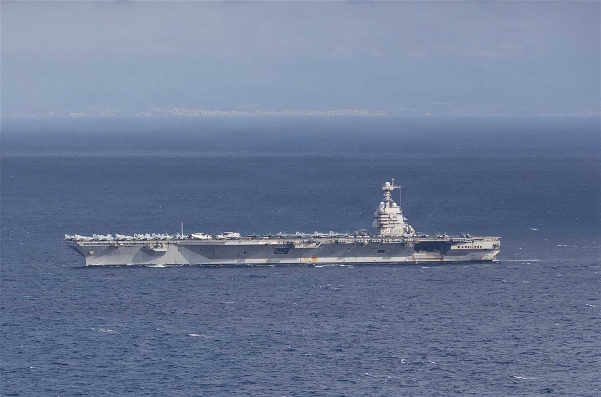 USS Gerald R. Ford (CVN 78), the U.S. Navy’s largest and most advanced aircraft carrier, sails through the Strait of Gibraltar on November 4, 2025, as part of its scheduled deployment with Carrier Strike Group 12.