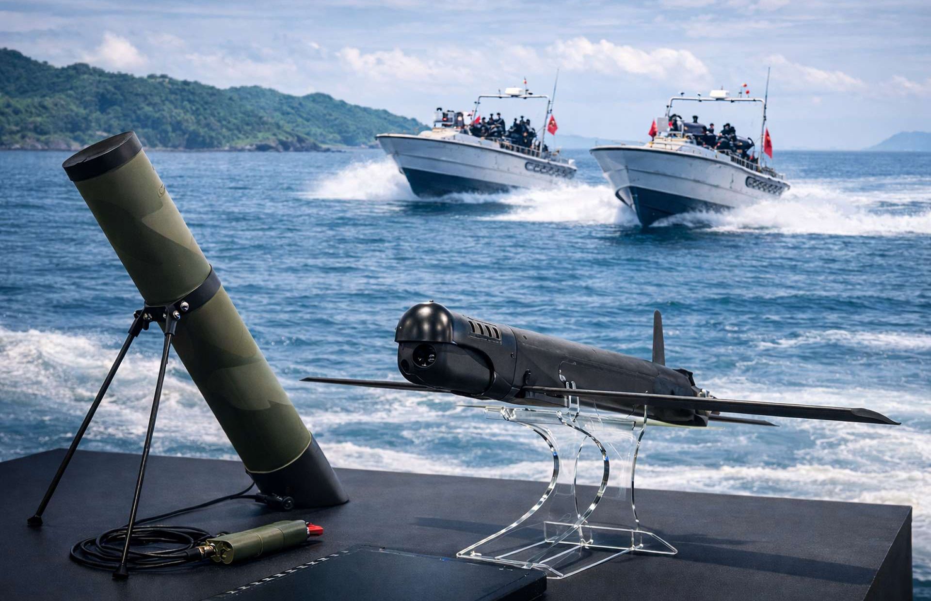 Chin Feng I is a tube-launched loitering munition with EO/IR sensors and AI-assisted targeting, able to strike moving coastal and maritime targets with a high-explosive warhead out to about 8 km from M96 fast boats (Picture source: Army Recognition Edit).