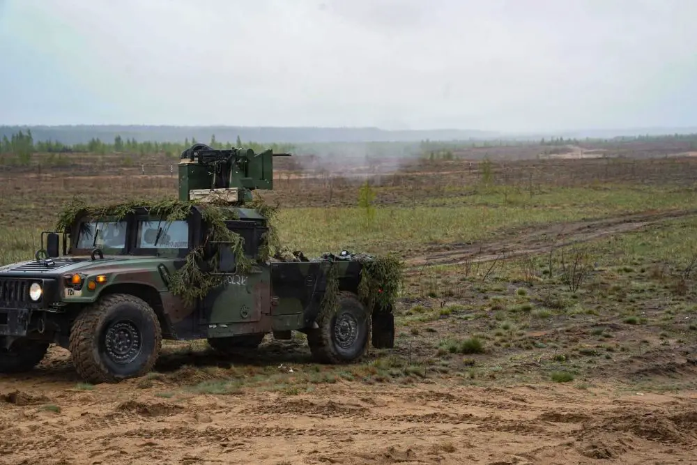 U.S. Army soldiers from the 5th Battalion, 4th Air Defense Artillery Regiment test a modified Humvee equipped with a CROWS remote weapon station and M2 Browning machine gun near Baltadvaris, Lithuania, on May 9, 2026. The improvised Mobile Fire Team vehicle, created by mounting a recycled CROWS turret onto a Humvee, provides a mobile low-cost counter-drone capability as part of NATO’s Eastern Flank Deterrence Initiative.