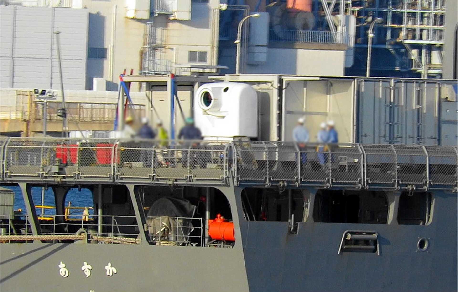Japanese Navy experimental test ship JS Asuka undergoing integration of ATLA’s 100kW-class laser weapon system at JMU Isogo shipyard, marking a critical step toward Japan’s first at-sea trials of a high-energy directed-energy weapon.