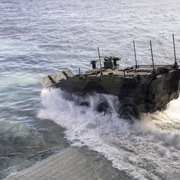A U.S. Marine Corps ACV-P Amphibious Combat Vehicle personnel carrier assigned to 3rd Assault Amphibian Battalion, 1st Marine Division, disembarks from the Wasp-class amphibious assault ship USS Makin Island (LHD 8) during Quarterly Underway Amphibious Readiness Training 26.2 off the coast of California on January 23, 2026.