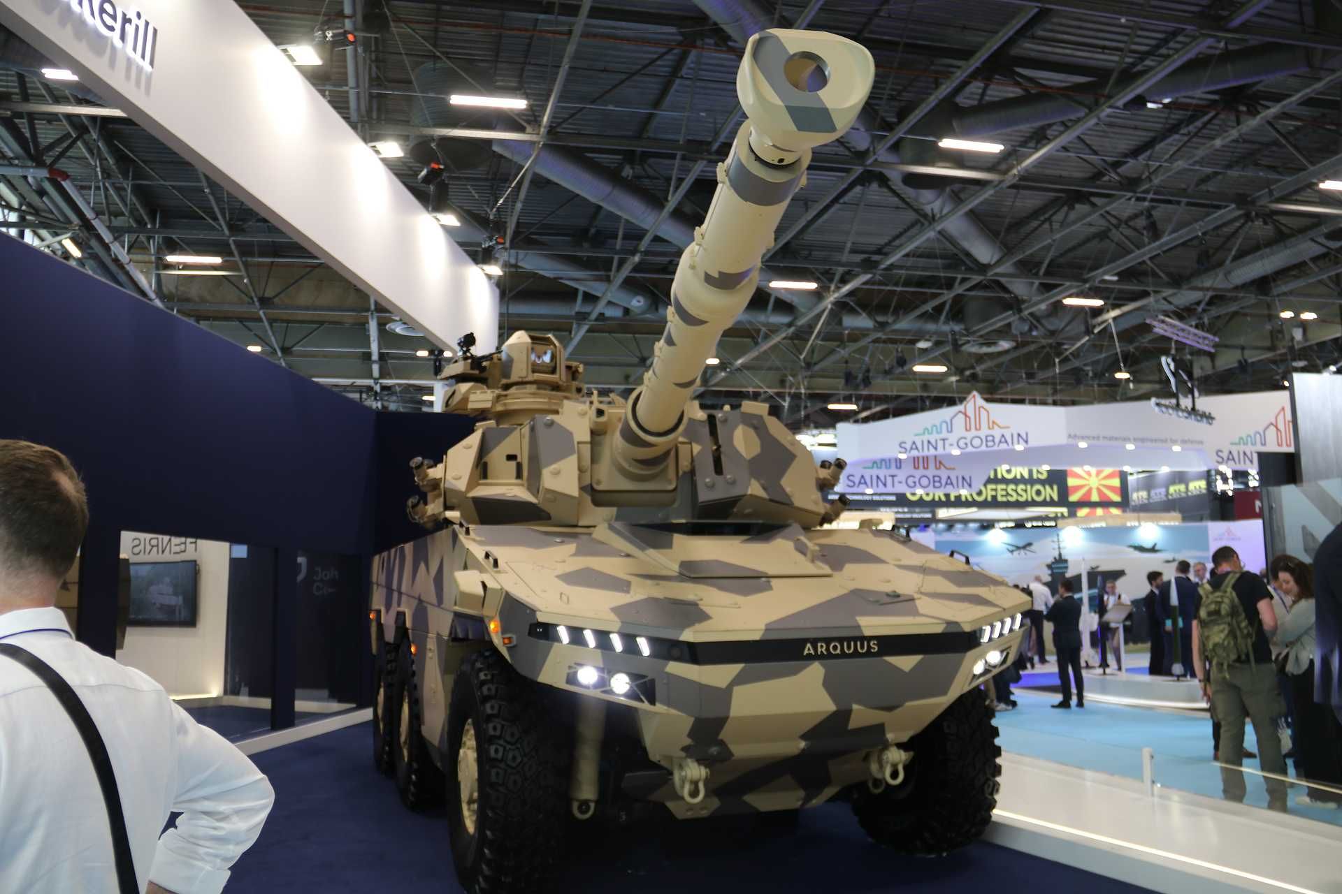 Belgian Company John Cockerill Defense unveils the new FENRIS 6x6 armored combat vehicle at Eurosatory 2026, combining a NATO-standard 105 mm high-pressure cannon with a 26-ton wheeled chassis designed for reconnaissance, direct-fire support, and rapid strategic deployment. (Picture source: Army Recognition Group)