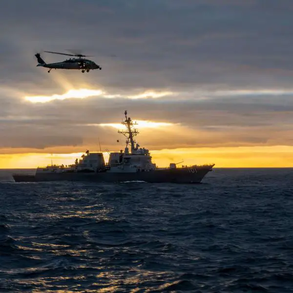 An MH-60S Sea Hawk conducts vertical replenishment near the Arleigh Burke-class destroyer USS Gridley and aircraft carrier USS Nimitz during Southern Seas 2026, demonstrating the U.S. Navy’s ability to sustain carrier strike group operations, preserve combat readiness, and strengthen maritime interoperability in the Pacific (Picture source: U.S. DoW).
