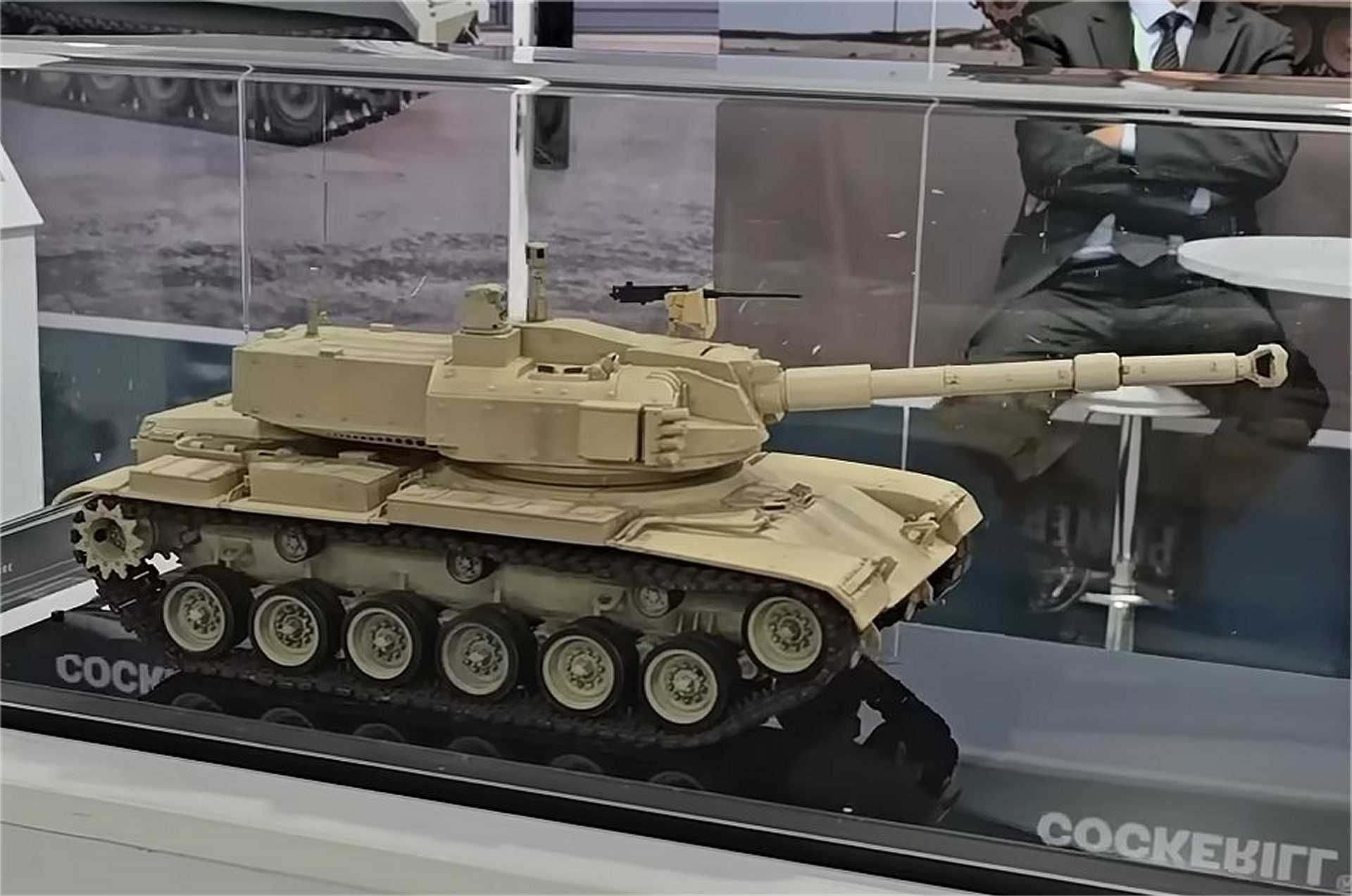 Scale model of the upgraded M60 tank featuring the John Cockerill 3105 weapon station on display at the John Cockerill Defense booth during EDEX 2025 in Cairo, Egypt. The concept illustrates a turret-replacement solution to revitalize legacy U.S.-made tanks with modern firepower and digital systems.