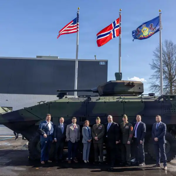 U.S. Marine Corps senior leaders and Kongsberg Defense Corp officials pose in front of a U.S. Marine Corps Amphibious Combat Vehicle during the February 20, 2026 ribbon-cutting ceremony at Kongsberg’s Johnstown, Pennsylvania facility, marking the launch of U.S.-based production for the ACV-30’s stabilized 30mm cannon system.