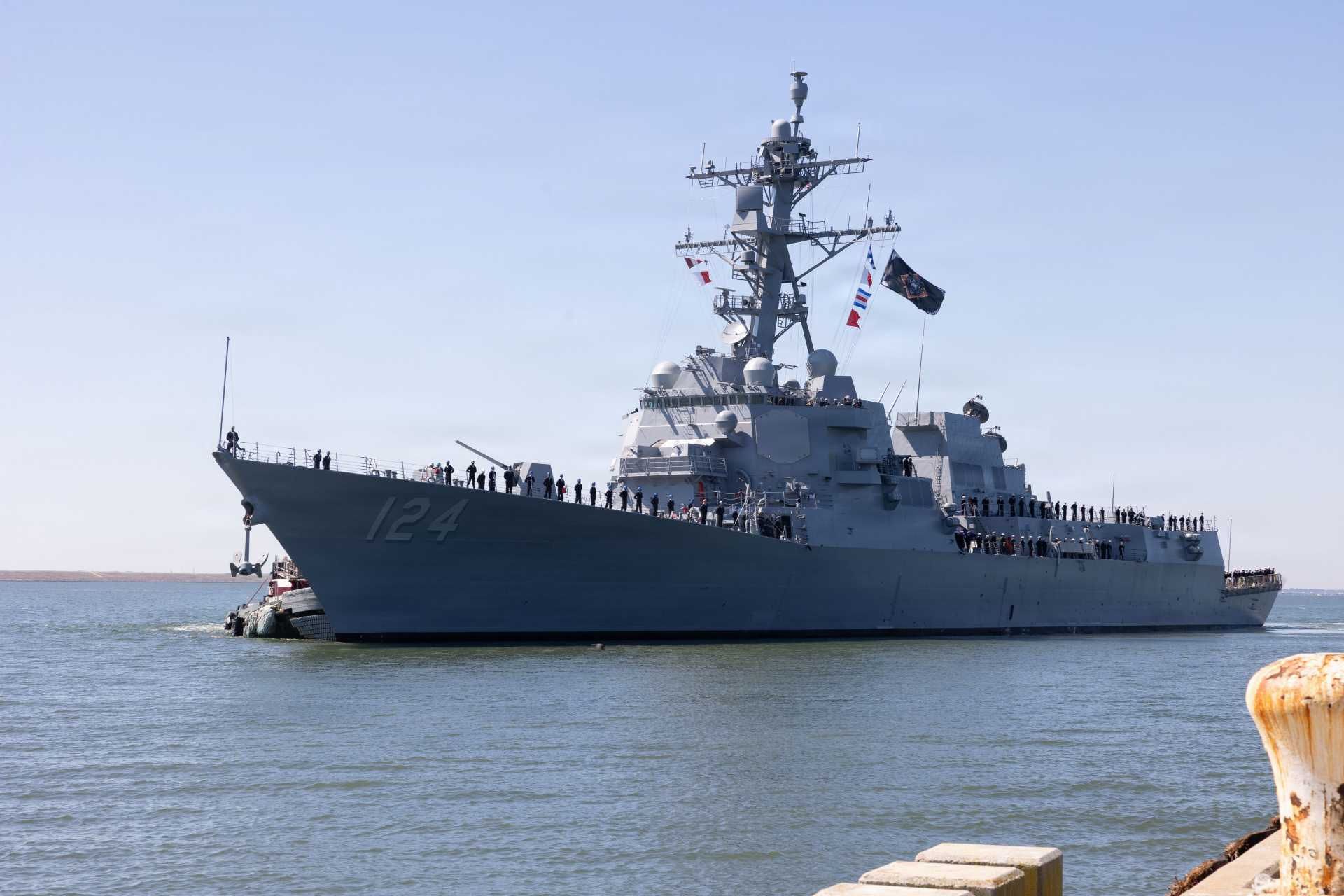 USS Harvey C. Barnum Jr. (DDG 124), a Flight IIA Arleigh Burke-class guided-missile destroyer, underway during post-commissioning operations, showcasing its AN/SPY-1D(V) Aegis radar arrays and 96-cell Mk 41 Vertical Launch System configured for integrated air and missile defense, long-range strike, and anti-submarine warfare missions within U.S. Navy distributed maritime operations.
