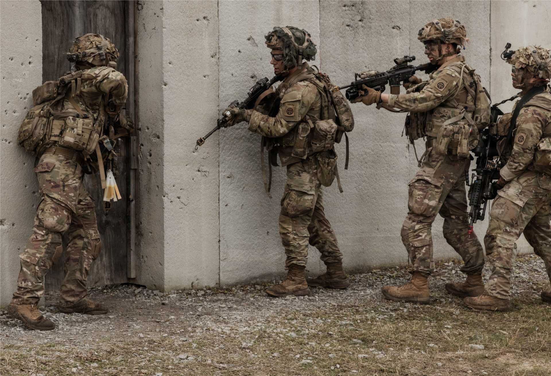 U.S. Army paratroopers assigned to the 3rd Brigade Combat Team, 82nd Airborne Division, conduct close-quarters battle training during a live-fire exercise at the Joint Readiness Training Center, Fort Polk, Louisiana, March 10, 2026, demonstrating rapid-response combat capabilities aligned with potential deployment scenarios supporting Project Freedom and maritime security operations.