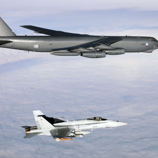 A U.S. Air Force B-52H Stratofortress flying from Spain teamed up with Finnish F/A-18 Hornet fighters over Finland, combining long range strike power with agile local air cover in NATO’s Arctic neighborhood (Picture Source: U.S. Air Force)