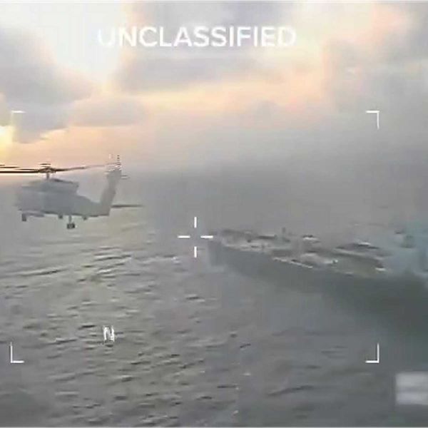 U.S. Coast Guard personnel conduct a high-risk boarding of the oil tanker Centuries in international waters east of Barbados, supported by U.S. Navy helicopters during a maritime interdiction operation targeting sanctioned Venezuelan crude en route to China.