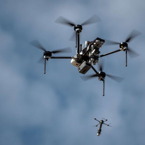 The Australian-made DefendTex D155 heavy-lift drone acts as a “mothership” for multiple Drone 40 micro-UAVs, carrying up to 13 kg of payload for about 90 minutes and deploying reconnaissance or strike drones mid-air to extend battlefield reach (Picture source: Singapore Ministry of Defense).