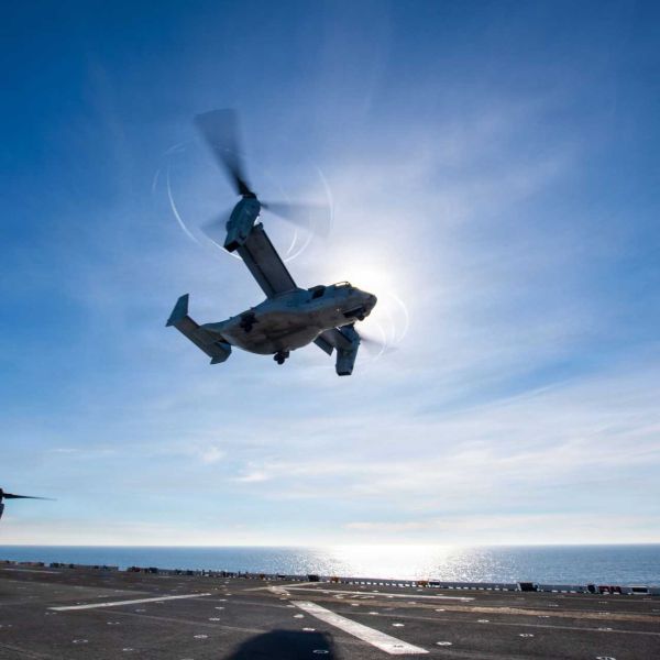 An MV-22B Osprey assigned to VMM-163 lifts off from the flight deck of USS Boxer during integrated ARG-MEU training operations in the Indo-Pacific, demonstrating extended-range sea-based assault capability.