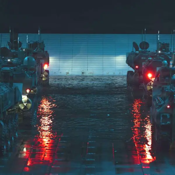 USMC Amphibious Combat Vehicle-Personnel (ACV-P) 8x8: armored, fully amphibious troop carrier launching from assault ships. Carries 3 crew + 13 Marines, swims in open-water surf, then continues high-speed cross-country. Remote weapon station (.50 cal or 40 mm Mk19) provides protected suppressive fire for ship-to-shore assault and inland security (Picture source: U.S. Marines).