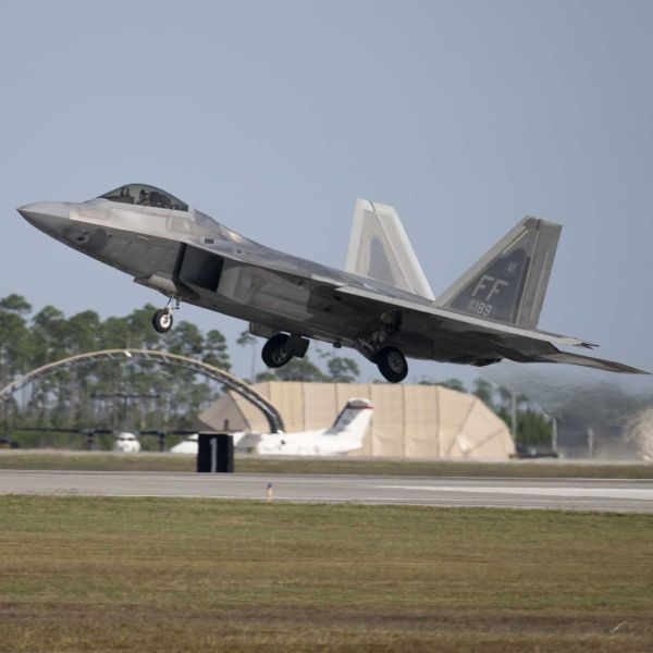 An F-22 Raptor fighter aircraft from the U.S. Air Force 27th Fighter Squadron, Joint Base Langley-Eustis, Virginia, takes off from Tyndall Air Force Base, Florida, during the Checkered Flag 26-1 air combat exercise on October 22, 2025.