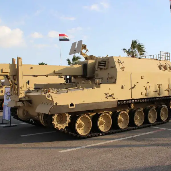 Within a K9 battery, the K10 can connect its conveyor arm to the rear of the howitzer, send ammunition automatically at a rate that exceeds manual methods, and complete the process quickly enough to allow the battery to displace before the enemy artillery can respond. (Picture source: Army Recognition)