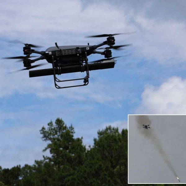 TRV-150 tactical resupply drone armed with a three-shot APKWS launcher launches a laser-guided 70 mm rocket during flight testing at Fort Rucker, Alabama, on May 20, 2026, demonstrating a new battalion-level precision-strike capability.