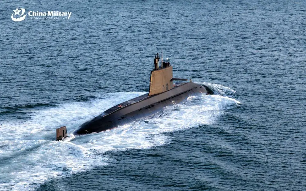 A Chinese People’s Liberation Army Navy nuclear-powered submarine sails during naval operations as China advances nuclear clock technology that could allow future submarines to navigate with extreme precision without GPS, potentially challenging U.S. Navy anti-submarine warfare dominance in the Indo-Pacific region.