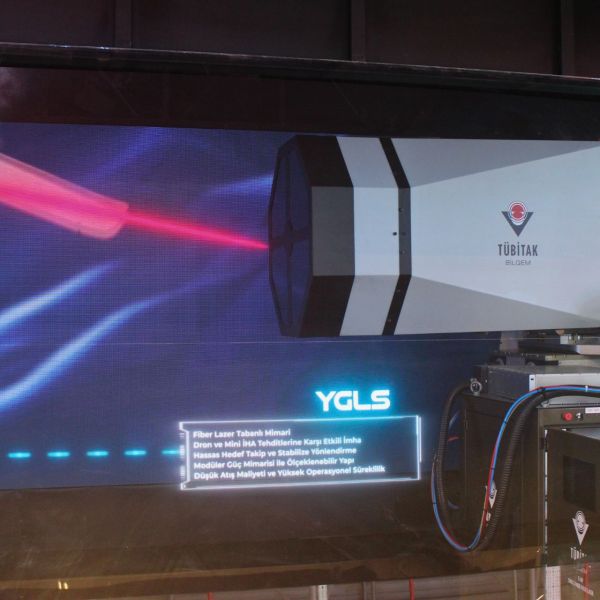 YGLS high-power laser system displayed at SAHA 2026 in Istanbul, developed by TÜBİTAK, featuring a stabilized beam director and modular architecture designed for counter-UAS missions with scalable output up to 80 kW.(Picture source: Army Recognition)