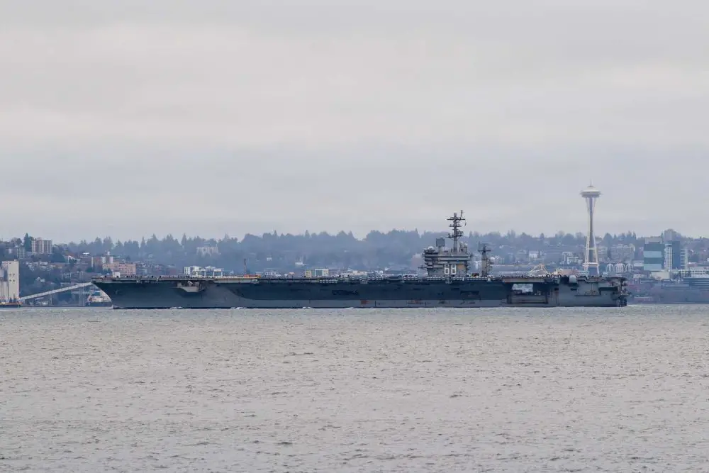 The U.S. Navy Nimitz-class aircraft carrier USS Nimitz (CVN 68) transits Puget Sound during its final departure from Naval Base Kitsap-Bremerton, Washington, March 7, 2026, as the ship prepares for its final operational phase before planned inactivation.