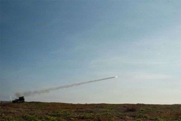 An AN/TWQ-1 Avenger short-range air defense system operated by Echo Battery, 6th Battalion, 52nd Air Defense Artillery Regiment, launches an FIM-92 Stinger missile to intercept and destroy a Griffon Aerospace MQM-170C Outlaw G2 Group 3 drone during an integrated air and missile defense live-fire exercise at Naval Station Leovigildo Gantioqui, Philippines, as part of Exercise Balikatan 2026 on April 27, 2026.