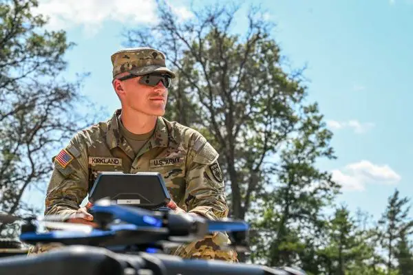 U.S. Army Specialist Elija Kirkland, assigned to 1st Battalion, 119th Field Artillery Regiment, operates an uncrewed aerial system in support of a cannon battery mission during Exercise Northern Strike 24-2 at Camp Grayling Joint Maneuver Training Center, Michigan.