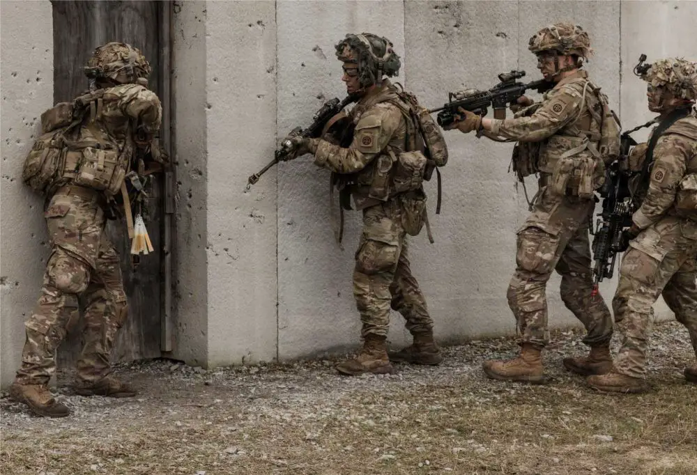 U.S. Army paratroopers assigned to the 3rd Brigade Combat Team, 82nd Airborne Division, conduct close-quarters battle training during a live-fire exercise at the Joint Readiness Training Center, Fort Polk, Louisiana, March 10, 2026, demonstrating rapid-response combat capabilities aligned with potential deployment scenarios supporting Project Freedom and maritime security operations.