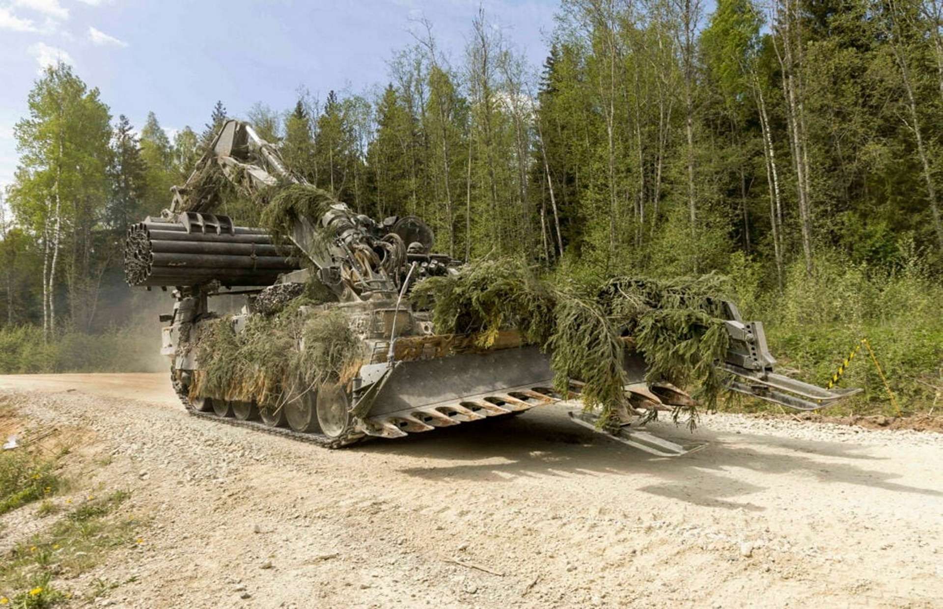 A British Army Titan and Trojan armoured engineering vehicles enable heavy armoured formations to manoeuvre under fire by breaching minefields, clearing obstacles, filling ditches, and rapidly emplacing armoured bridges of up to 60 metres, allowing tanks and infantry to maintain tempo across complex and contested terrain (Picture source: UK MoD/ Crown copyright).