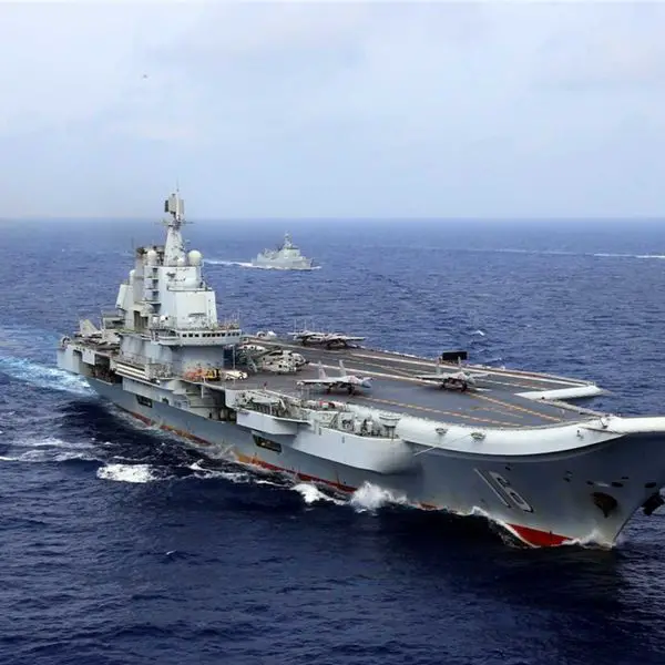 Chinese aircraft carrier Liaoning conducts live-fire combat drills in the Western Pacific as China expands its naval power projection capabilities.