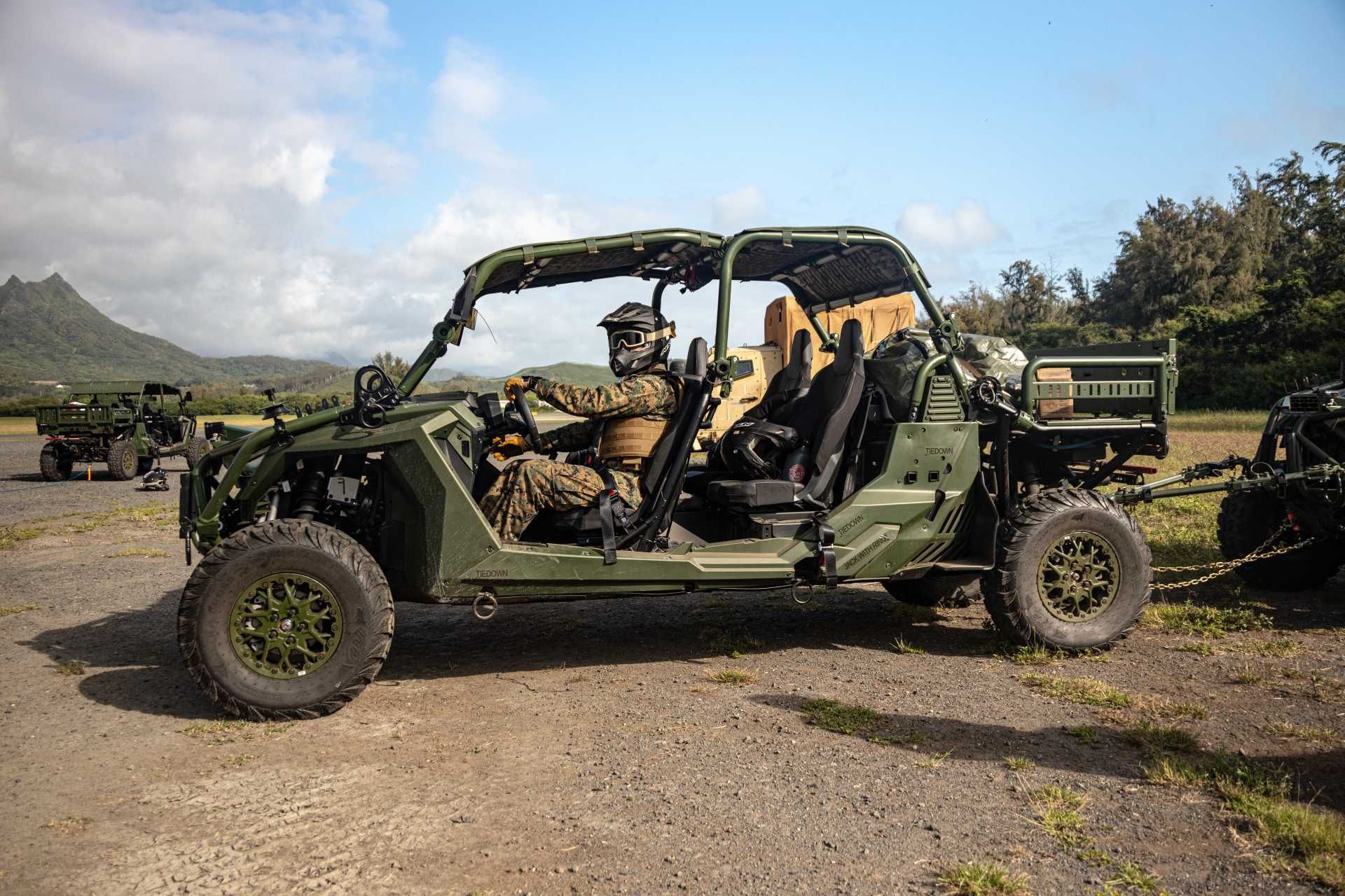 A U.S. Marine assigned to 3rd Marine Littoral Regiment, 3rd Marine Division, operates a Polaris Ultra-Light Tactical Vehicle during a driver licensing course at Marine Corps Training Area Bellows, Hawaii, demonstrating the expeditionary mobility capabilities supporting Force Design 2030 and distributed littoral operations.