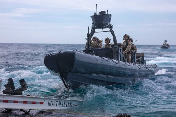 U.S. Marines from the 22nd Marine Expeditionary Unit deploy a rigid-hull inflatable boat from the well deck of the amphibious transport dock USS San Antonio (LPD 17) to conduct a visit, board, search, and seizure mission.