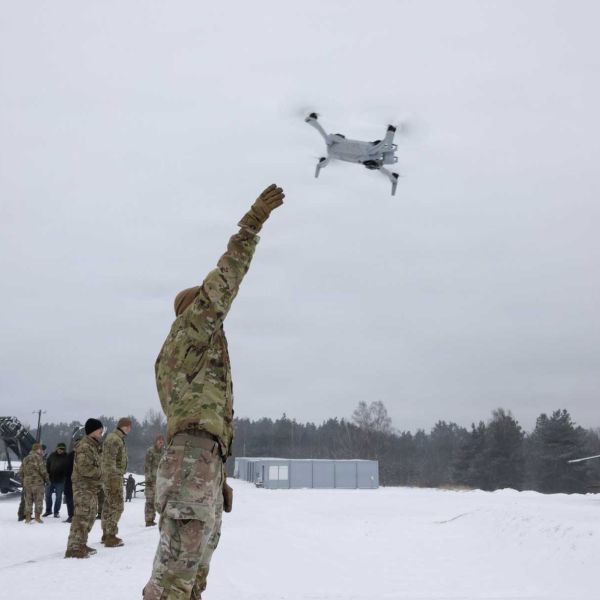 A U.S. Army soldier from the 3rd Squadron, 2nd Cavalry Regiment launches a drone during Operation Winter Falcon 26 at the Drawsko Combat Training Center in Oleszno, Poland, on January 13, 2026. The live drone deployment showcased how unmanned aerial systems are reshaping joint defensive tactics and battlefield awareness for future NATO operations along the alliance's eastern flank.