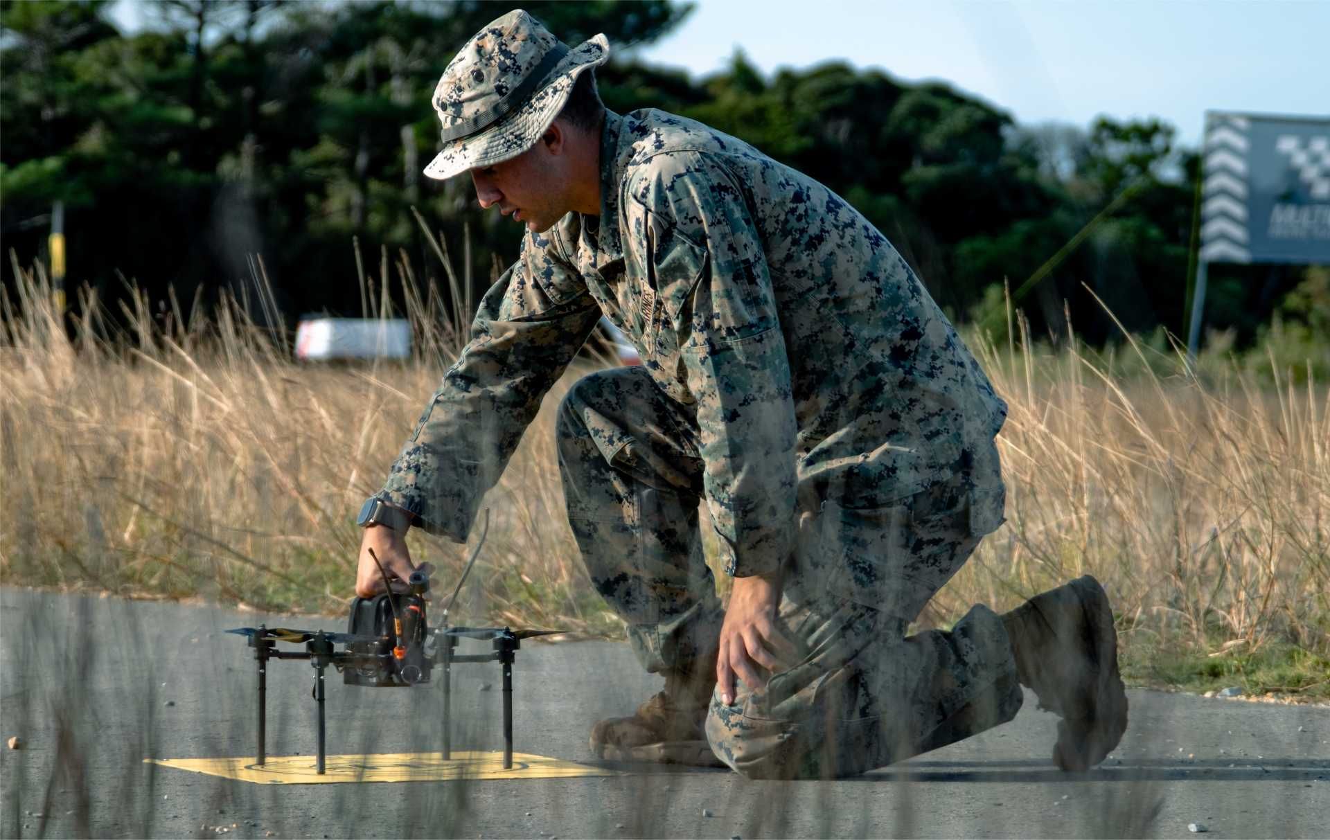 A U.S. Marine assigned to III Marine Expeditionary Force prepares an unmanned aerial system during the Marine Corps Attack Drone Competition at Camp Schwab, Okinawa, Japan.
